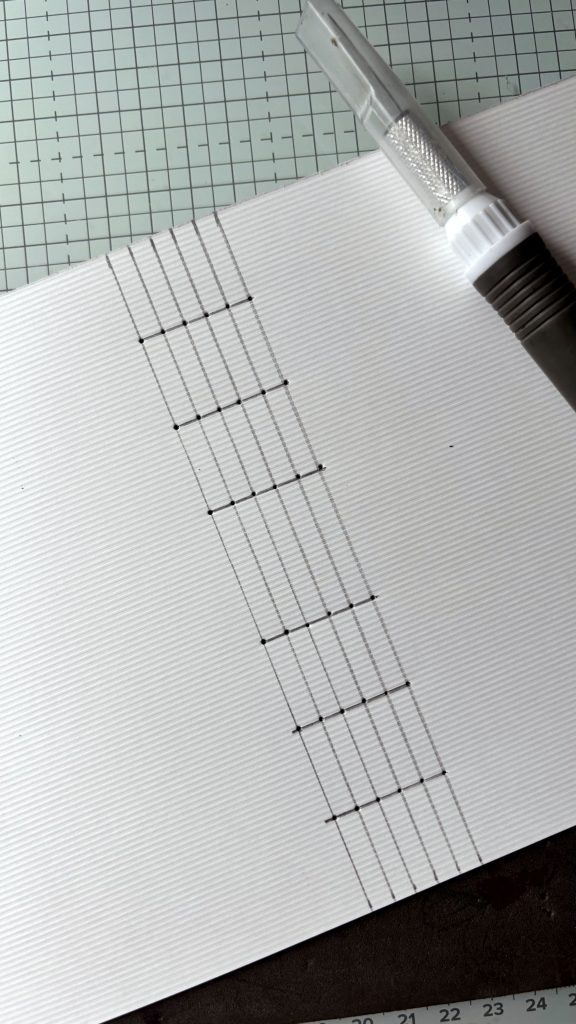 perçage de la couverture avec repères pour reliure point long dos apparent