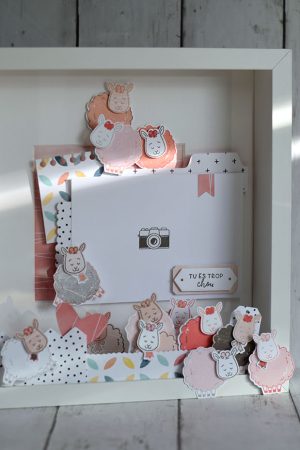 Cadre photo décoré sur le thème des moutons réalisé lors d'un atelier scrapbooking naissance